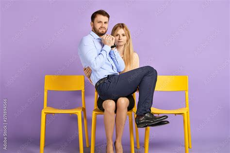 man sitting on woman